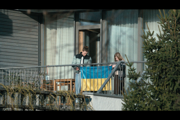 A scene from HOW TO DIVORCE DURING THE WAR, a film by Andrius Blaževičius. A Zeitgeist Films release in association with Kino Lorber.