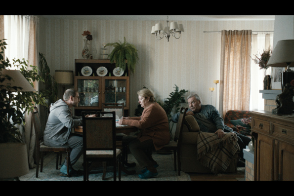 A scene from HOW TO DIVORCE DURING THE WAR, a film by Andrius Blaževičius. A Zeitgeist Films release in association with Kino Lorber.