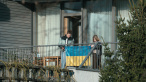 A scene from HOW TO DIVORCE DURING THE WAR, a film by Andrius Blaževičius. A Zeitgeist Films release in association with Kino Lorber.