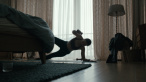 A scene from HOW TO DIVORCE DURING THE WAR, a film by Andrius Blaževičius. A Zeitgeist Films release in association with Kino Lorber.