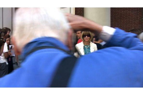 Bill photographing Vogue editor-in-chief Anna Wintour. A scene from BILL CUNNINGHAM NEW YORK. A Zeitgeist Films release.